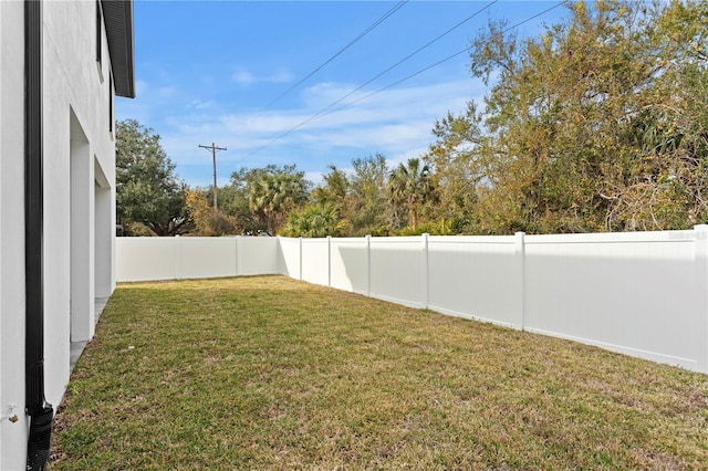 view of yard with a fenced backyard