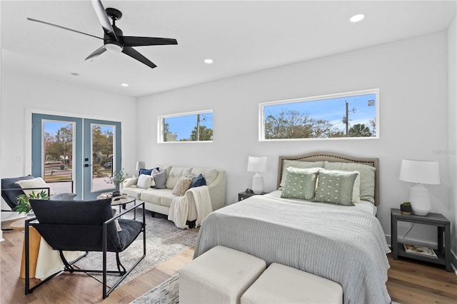 bedroom with ceiling fan, recessed lighting, wood finished floors, access to outside, and french doors