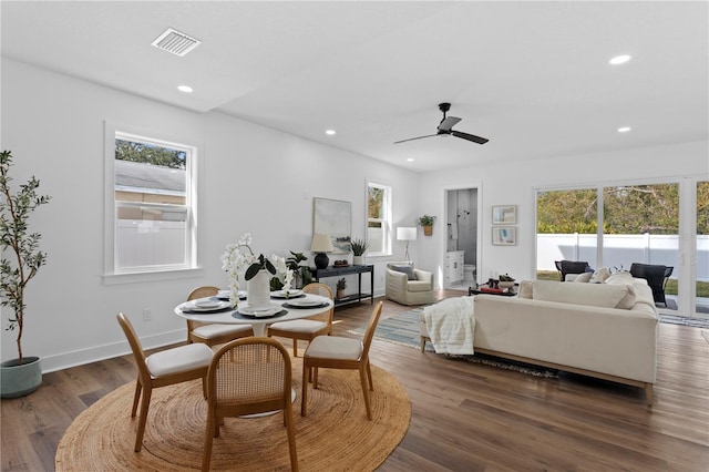 dining room featuring dark wood-style floors, recessed lighting, a healthy amount of sunlight, and visible vents