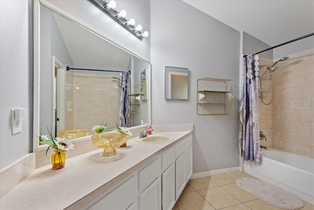 bathroom featuring tile patterned flooring, vanity, and shower / bath combo with shower curtain