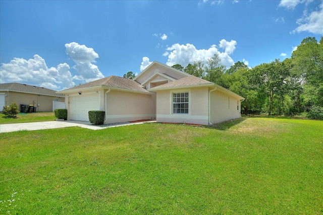 single story home with a garage and a front lawn