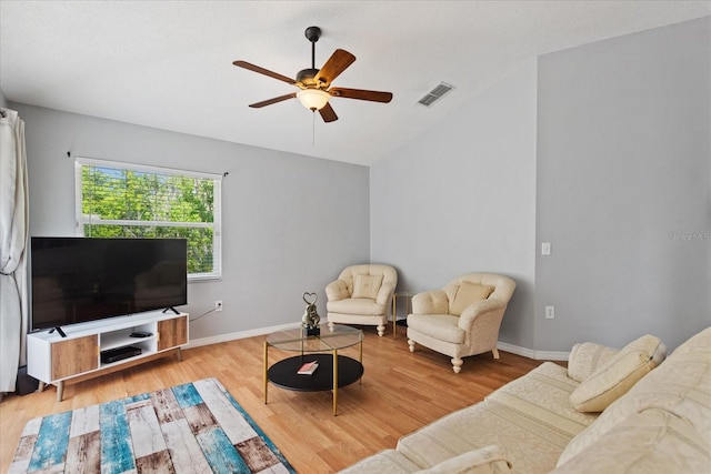 living room with ceiling fan and light hardwood / wood-style floors