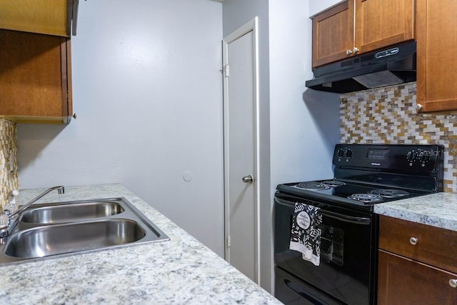 kitchen featuring black range with electric cooktop, sink, and backsplash