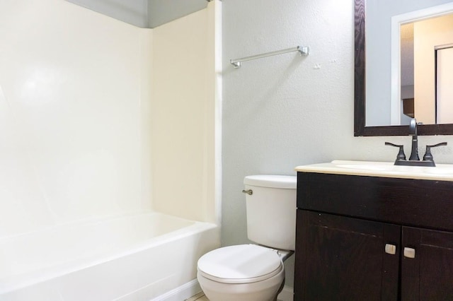 full bathroom featuring tub / shower combination, vanity, and toilet