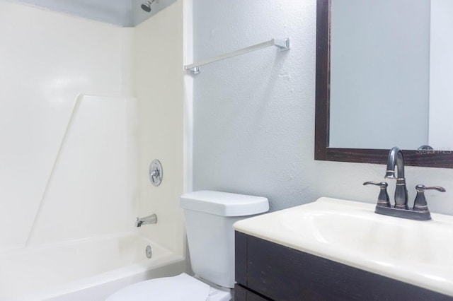 full bathroom featuring shower / tub combination, vanity, and toilet