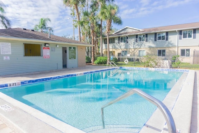 view of swimming pool with a patio