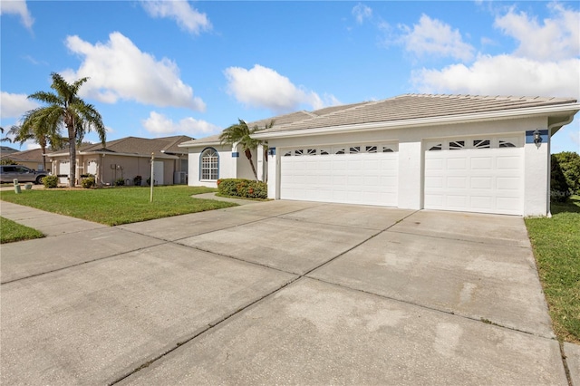 ranch-style home with a front yard and a garage