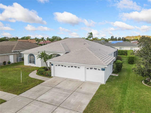 ranch-style house with a garage and a front yard