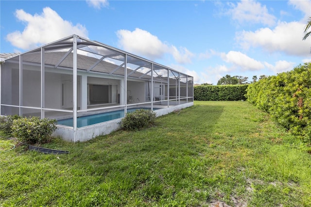 view of yard featuring glass enclosure