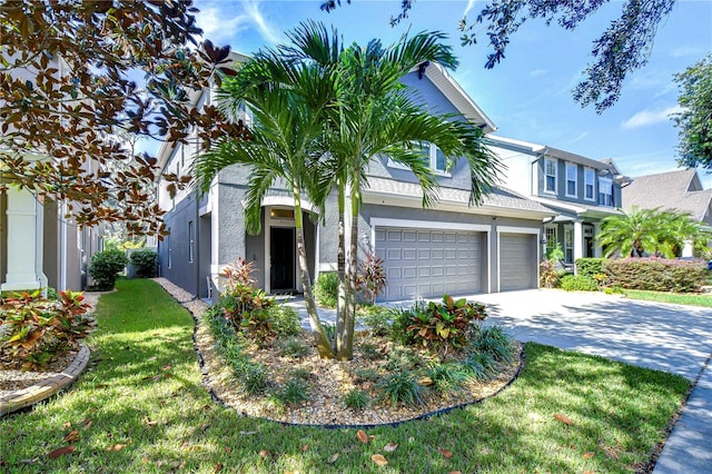 view of front of house featuring a front yard and a garage