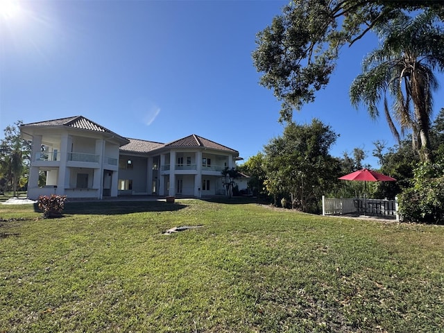 view of yard with a balcony and a patio area