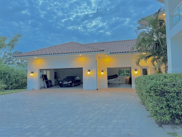 back of house featuring a garage