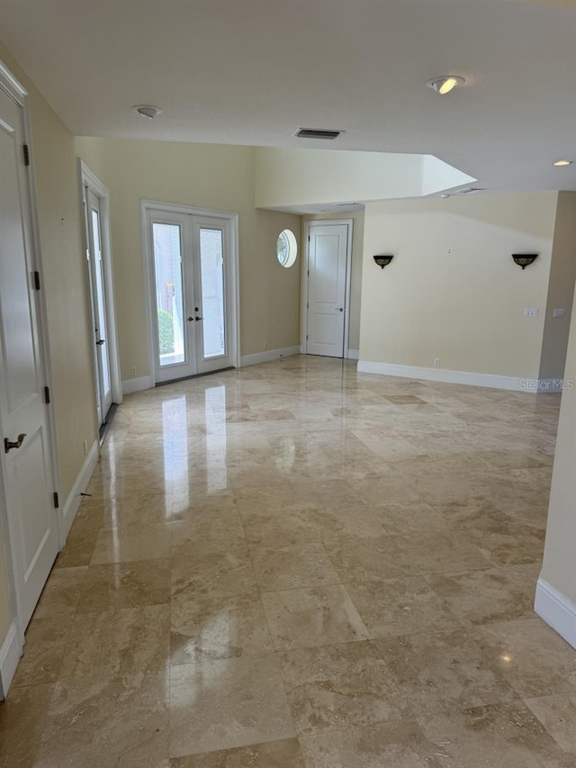 spare room featuring french doors