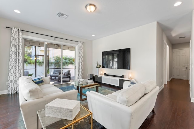 living room featuring dark wood-type flooring