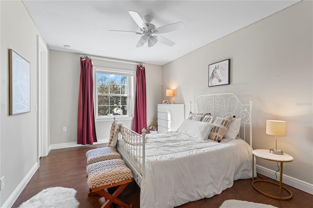 bedroom featuring ceiling fan and dark hardwood / wood-style flooring