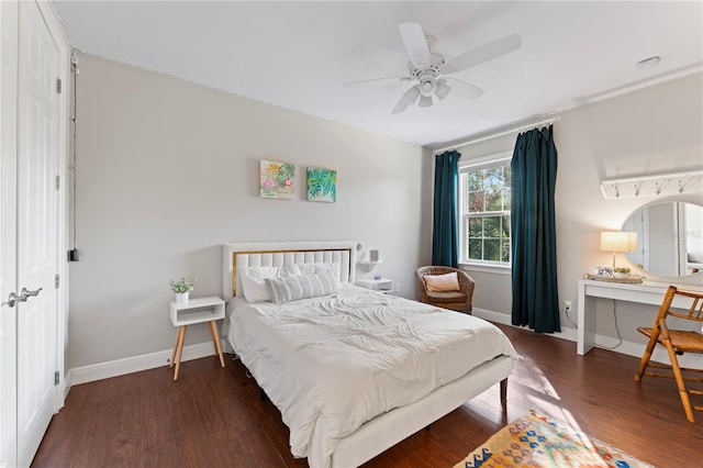 bedroom featuring ceiling fan and dark hardwood / wood-style flooring