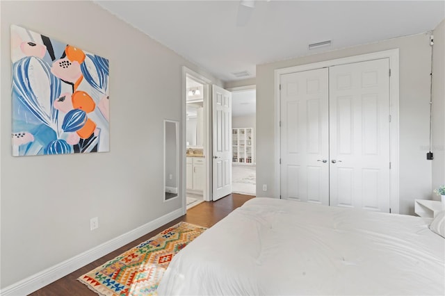 bedroom with ceiling fan, a closet, and dark wood-type flooring