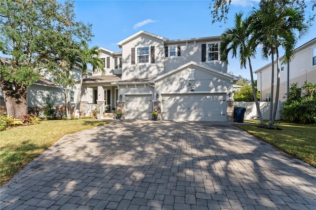 view of front facade with a front yard and a garage