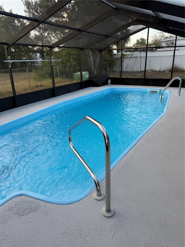 view of pool featuring a lanai