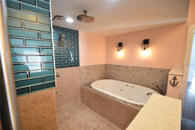 bathroom featuring tiled tub