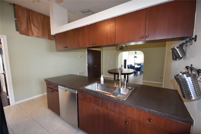 kitchen with stainless steel dishwasher, light tile patterned floors, and sink