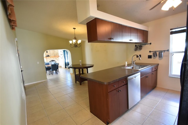 kitchen featuring dishwasher, sink, kitchen peninsula, light tile patterned flooring, and ceiling fan with notable chandelier