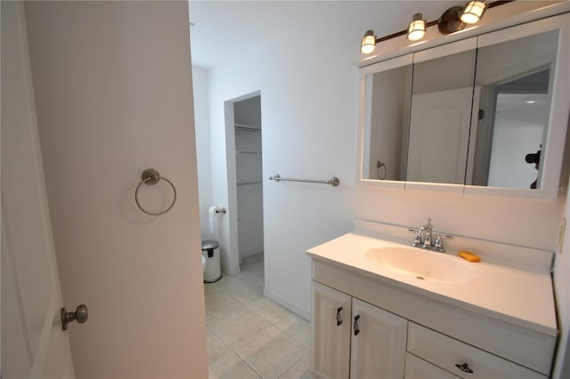 bathroom featuring tile patterned flooring and vanity