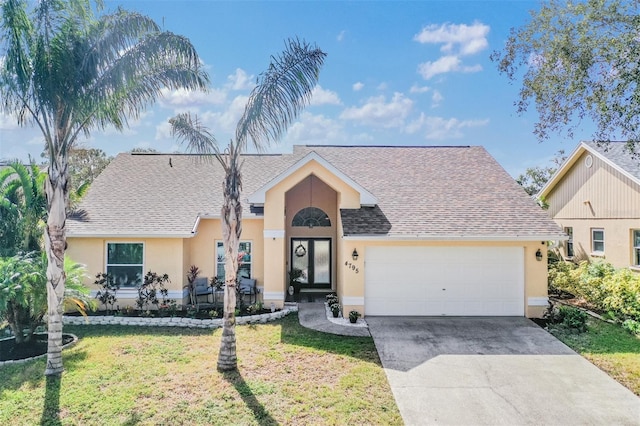 ranch-style house with a front yard and a garage