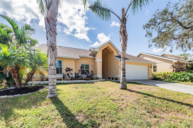 ranch-style house featuring a garage and a front yard