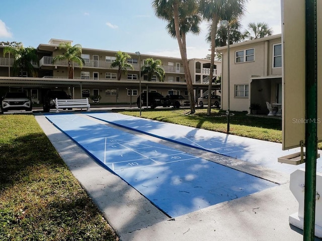 view of property's community with a lawn