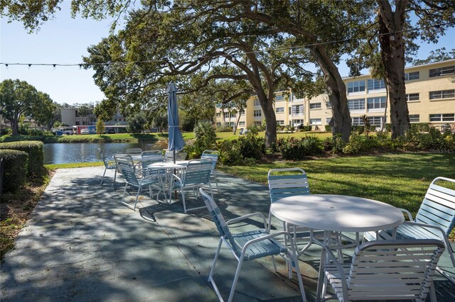 view of patio featuring a water view