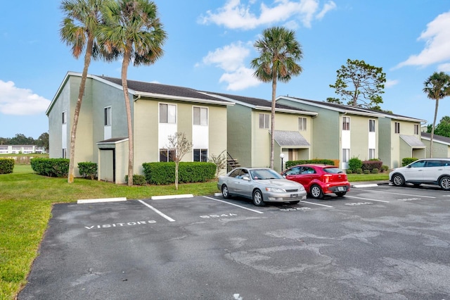 554 Fairways Cir Unit A, Ocala, FL 34472 - view of building exterior with uncovered parking