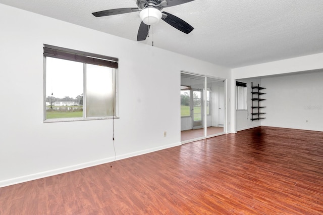 unfurnished room with a textured ceiling, hardwood / wood-style flooring, and ceiling fan