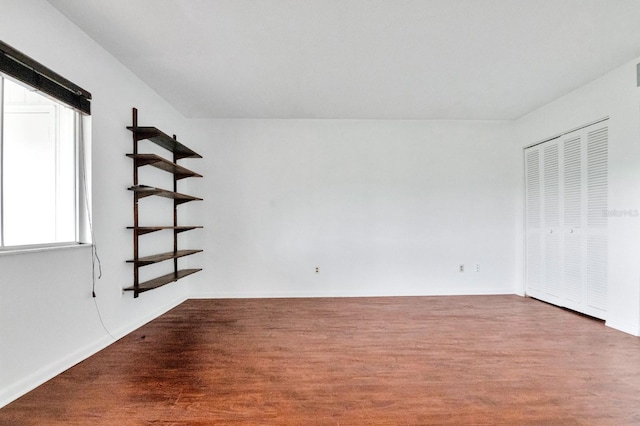 554 Fairways Cir Unit A, Ocala, FL 34472 - unfurnished bedroom with wood finished floors and a closet