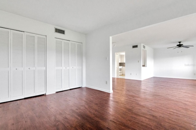 554 Fairways Cir Unit A, Ocala, FL 34472 - unfurnished bedroom with two closets, wood finished floors, and baseboards