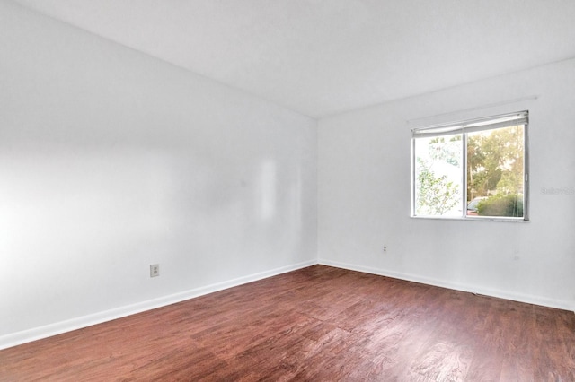 554 Fairways Cir Unit A, Ocala, FL 34472 - empty room featuring dark wood finished floors and baseboards