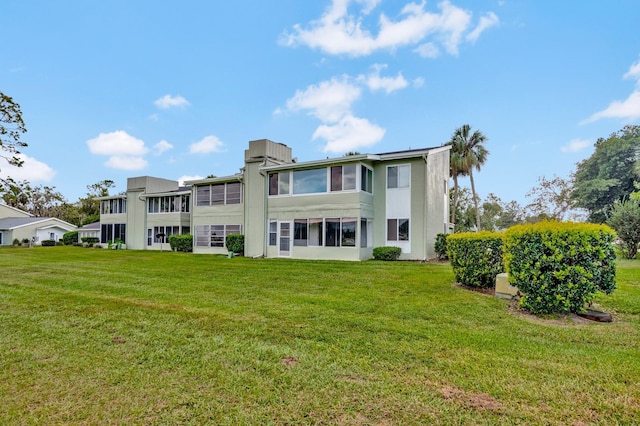 554 Fairways Cir Unit A, Ocala, FL 34472 - back of property with a yard