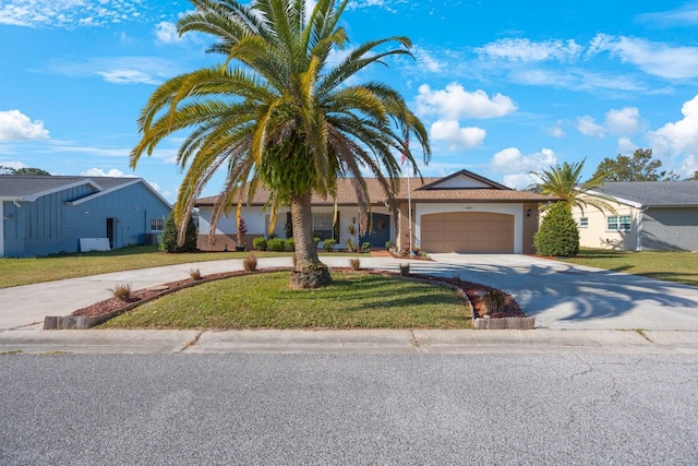 single story home featuring a garage and a front lawn