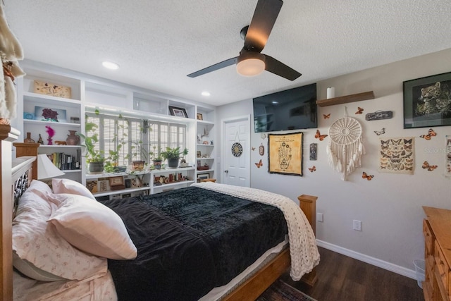 bedroom with ceiling fan, dark hardwood / wood-style floors, a closet, and a textured ceiling