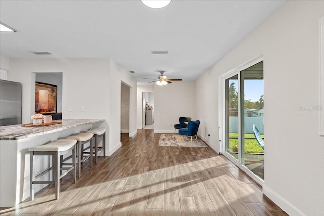 interior space featuring hardwood / wood-style flooring and ceiling fan