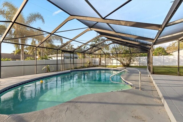 view of pool featuring a lanai and a patio