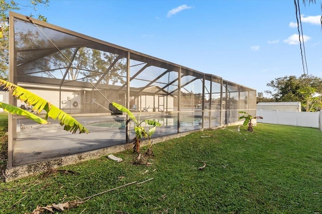 view of yard with glass enclosure