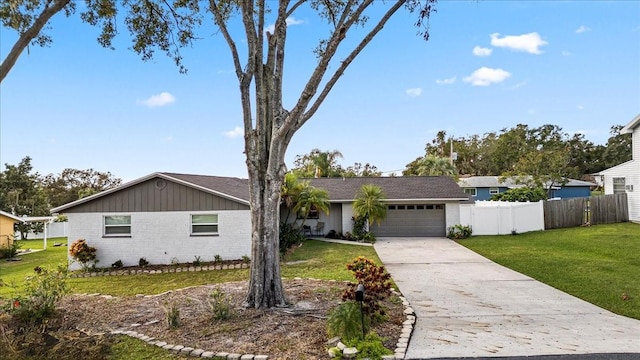 single story home with a garage and a front yard