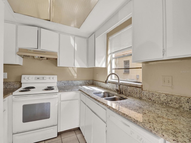 kitchen featuring light tile patterned flooring, white appliances, white cabinetry, and sink