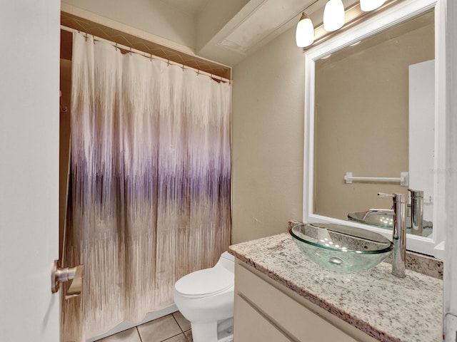 bathroom with tile patterned floors, vanity, and toilet