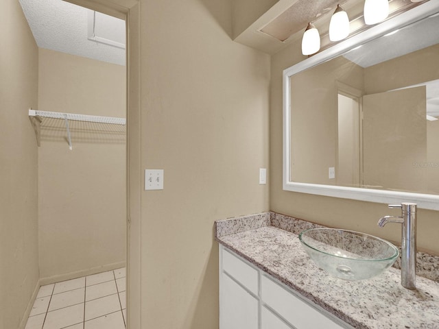 bathroom with vanity and tile patterned floors