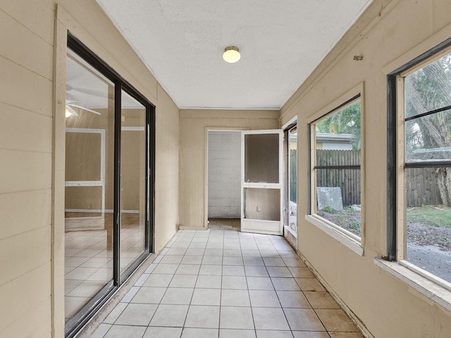 unfurnished sunroom with a healthy amount of sunlight