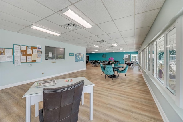 interior space featuring hardwood / wood-style floors and a paneled ceiling