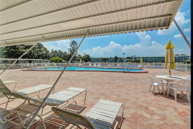 view of swimming pool with a patio area