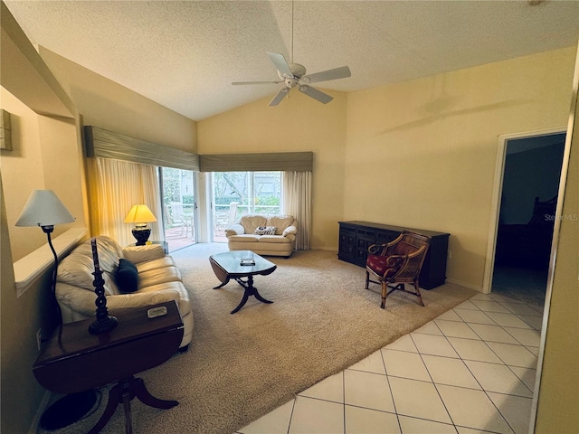 living room with light tile patterned floors, a textured ceiling, ceiling fan, and lofted ceiling